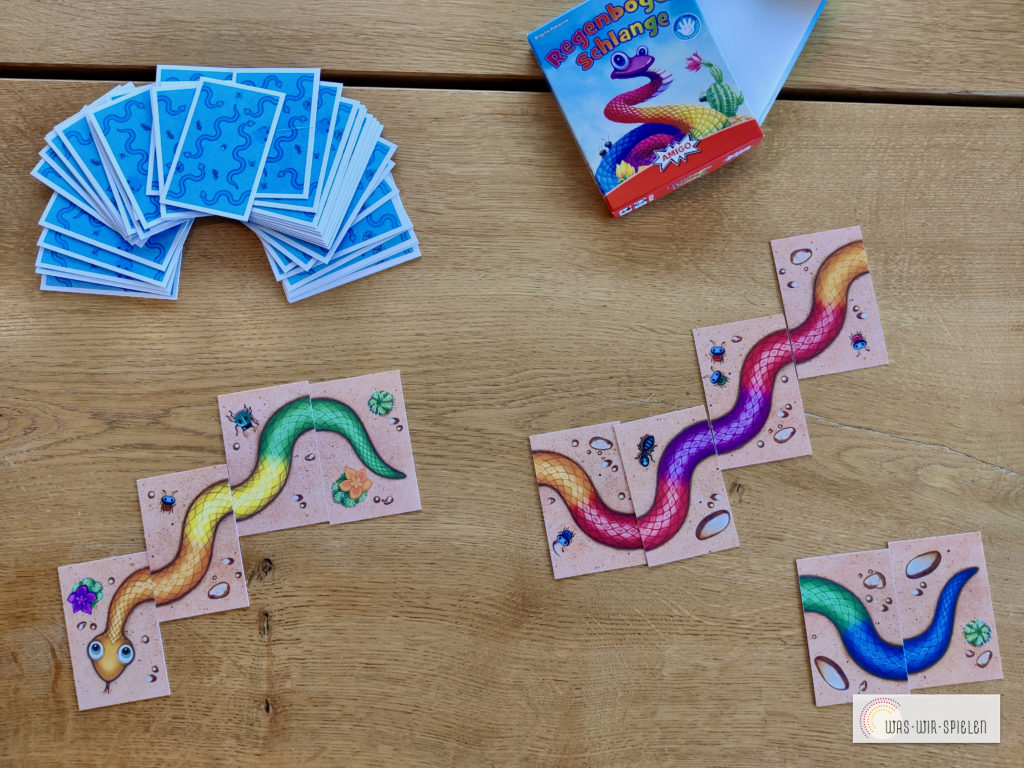 Das Kartenspiel "Die Regenbogenschlange"